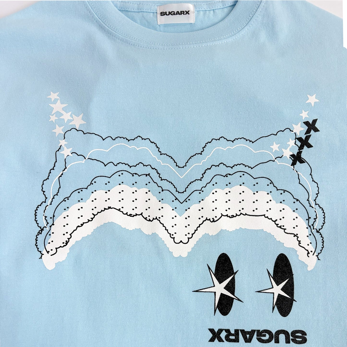 サックスブルー長袖Tシャツ、雲と星のフロントプリント
